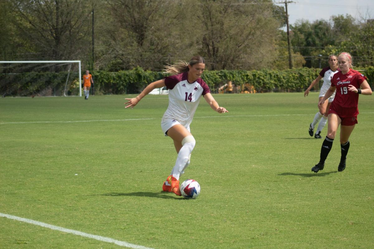 Texas State junior defender Anna Dunch (14) dribbles the ball down the sideline during the game against Louisiana-Lafayette, Sunday, Sept. 17, 2023, at Bobcat Soccer Complex.