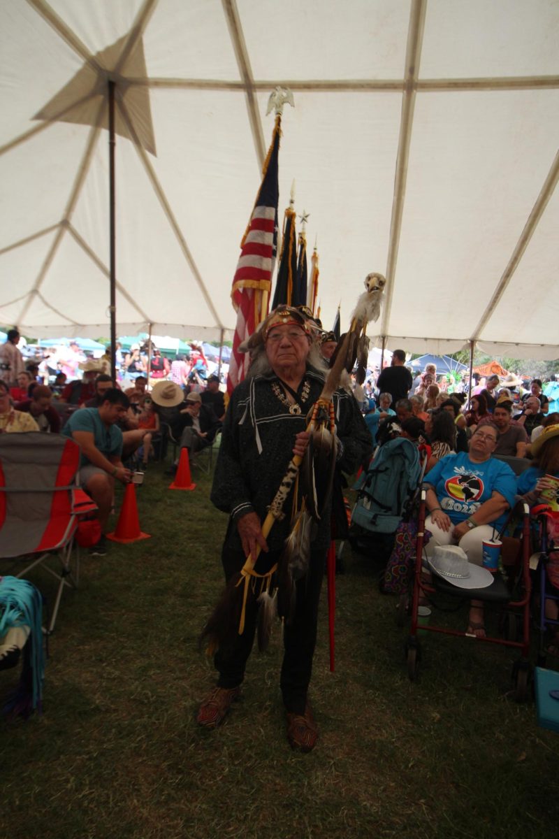 The principal founder of the Indigenous Cultures Institute, Mario Garza, leads the color guard, Sunday, Oct. 2, 2022, at the 12th annual Sacred Springs Powwow at The Meadows Center.