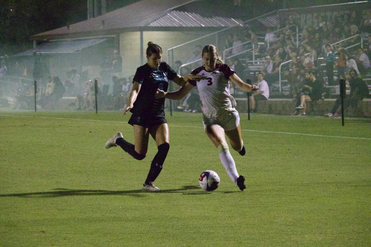 Texas State junior defender Lucy Hart (3) dribbles the ball past a defender, Thursday, Oct. 5, 2023, at Bobcat Soccer Complex. 