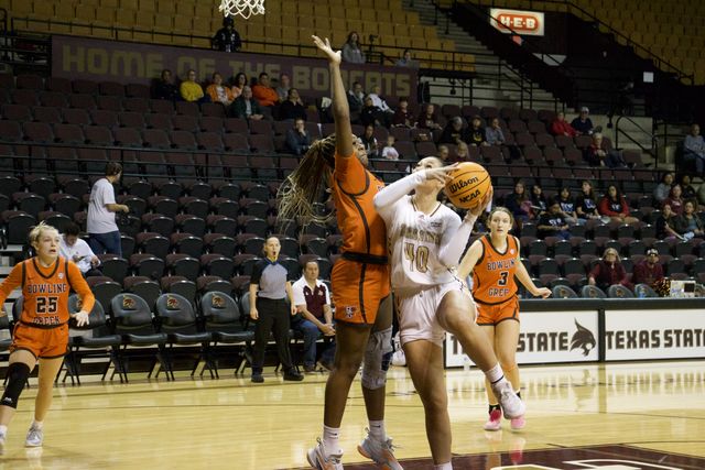 Texas State senior forward Nicole Leff (40), shoots the ball over the head of her Bowling Green defender, Saturday, Nov. 11, 2023, at Strahan Arena. 