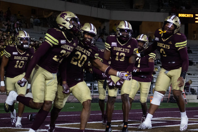 The Texas State football team celebrates a touchdown against South Alabama, Saturday, Nov. 25, 2023, at Bobcat Stadium.