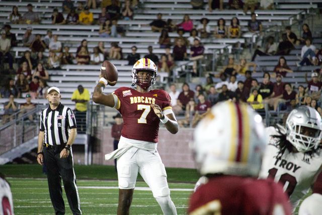 Texas State redshirt sophomore quarterback T.J. Finley (7) attempts a pass against Troy, Saturday, Oct. 28, 2023, at Bobcat Stadium.