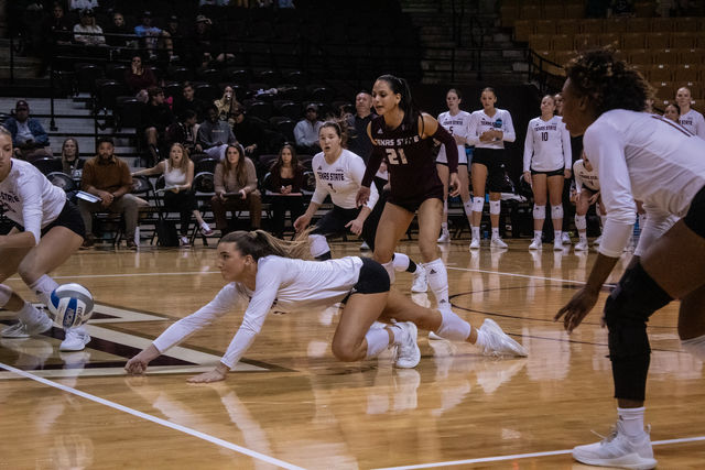 Texas State sophomore outside hitter Maggie Walsh (2) dives to save the ball during the game against Coastal Carolina, Friday, Nov. 10, 2023 at Strahan Arena.