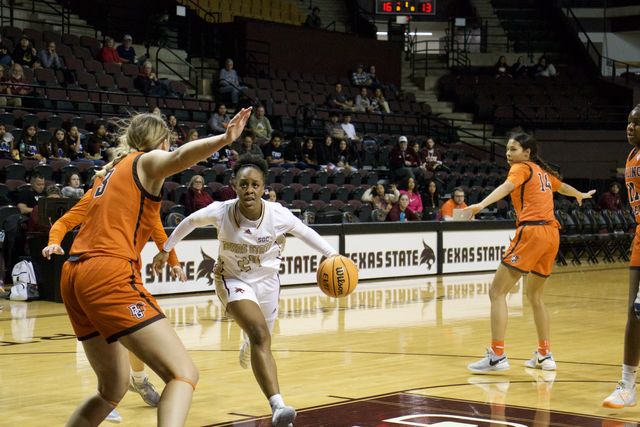 Texas State graduate student guard Timia Jefferson (24) dribbles towards the basket, Saturday, Nov. 11, 2023, at Strahan Arena. 