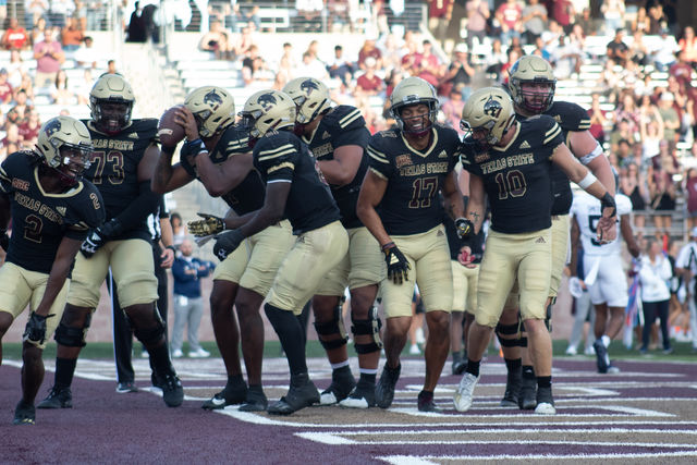 The Texas State football team celebrate a touchdown during the game against Georgia Southern, Saturday, Nov. 4, 2023 at Bobcat Stadium.