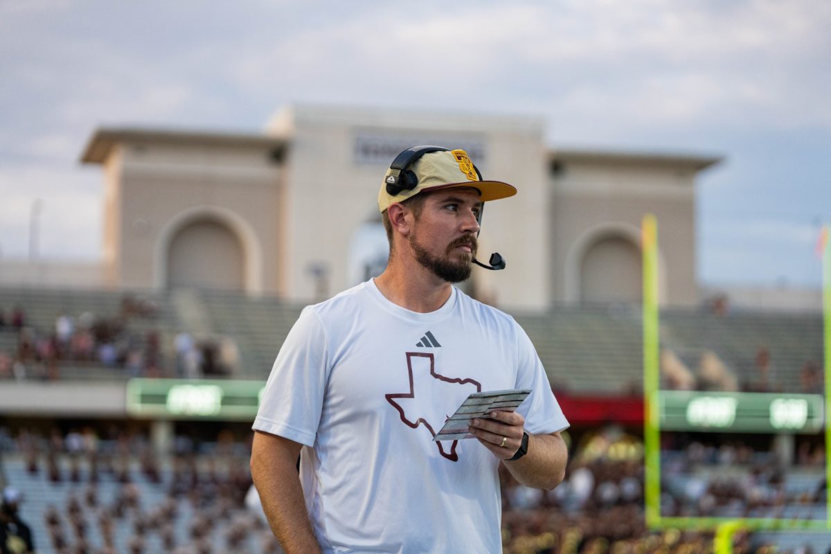 Texas State offensive coordinator Mack Leftwich calls a play on the sideline during the Nevada game, Saturday, Sept. 23, 2023, at Bobcat Stadium.