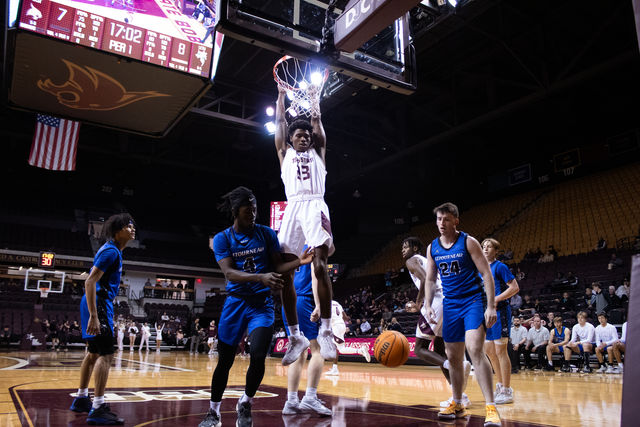 Texas State guard junior Joshua OGarro (23) dunks the ball during the game against LeTourneau, Monday, Dec. 18, 2023, at Strahan Arena.