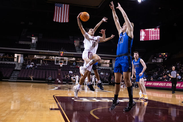 Texas State freshman guard Kaden Gumbs (11) goes in for a layup during the game against LeTourneau, Monday, Dec. 18, 2023, at Strahan Arena.