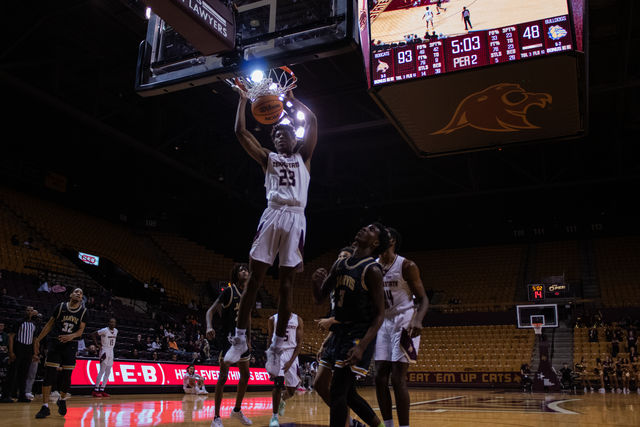 Texas State junior guard Joshua OGarro (23) dunks the ball during the game against Jarvis Christian, Monday, Dec. 11, 2023, at Strahan Arena.