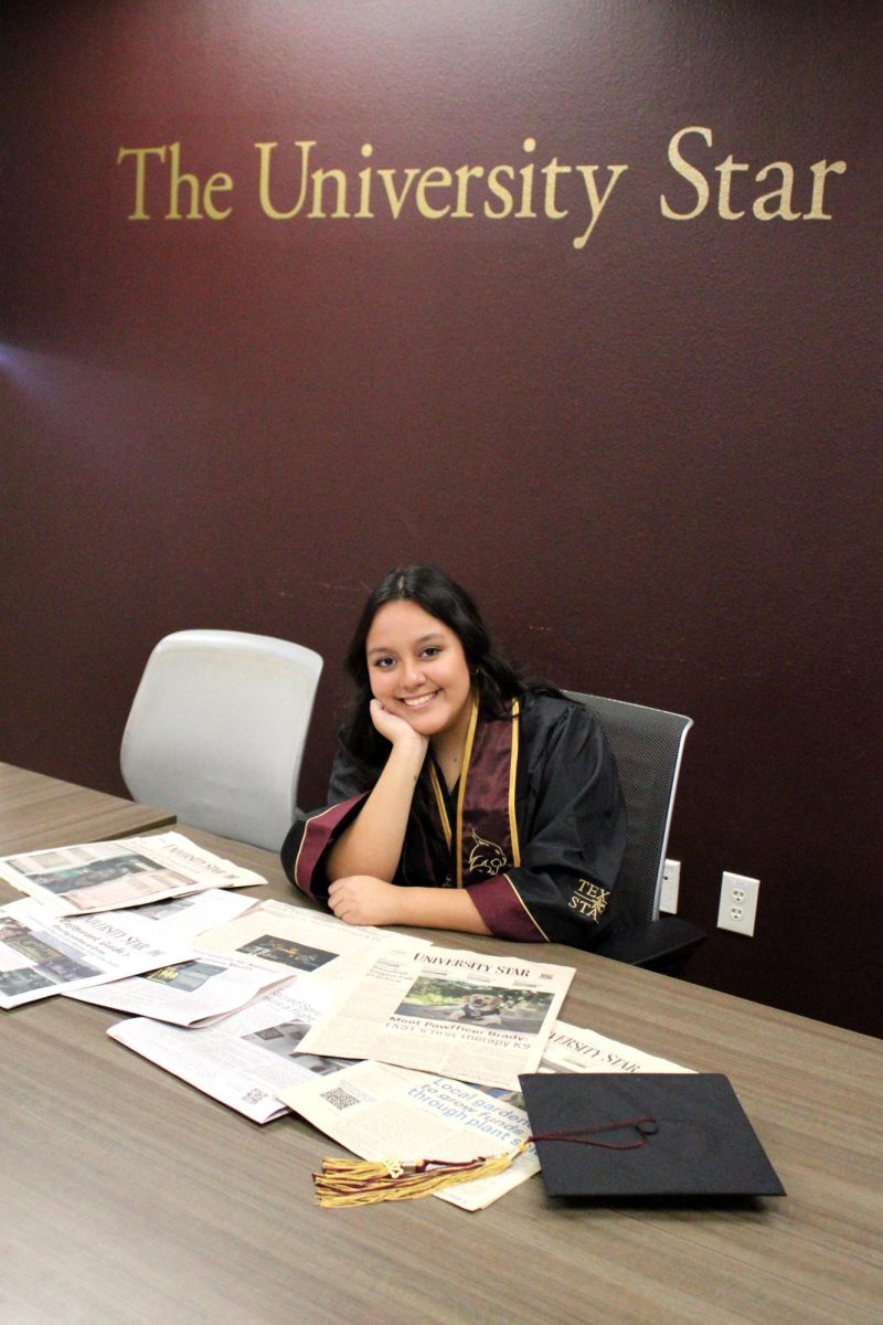 Texas State journalism senior Haley Velasco poses with her stories, Friday, Nov. 24, 2023, at the Trinity Building.