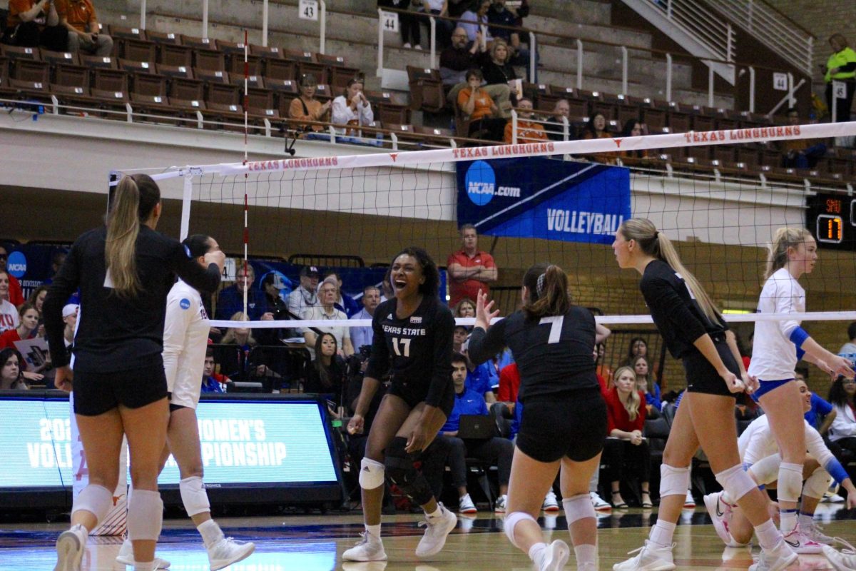 The Texas State volleyball team celebrates a point against SMU, Thursday, Nov. 30, 2023, at Gregory Gymnasium in Austin, Texas. 
