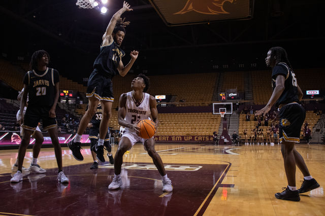 Texas State junior guard Joshua OGarro (23) attempts to score against Jarvis Christian, Monday, December 11, 2023, at Strahan Arena.