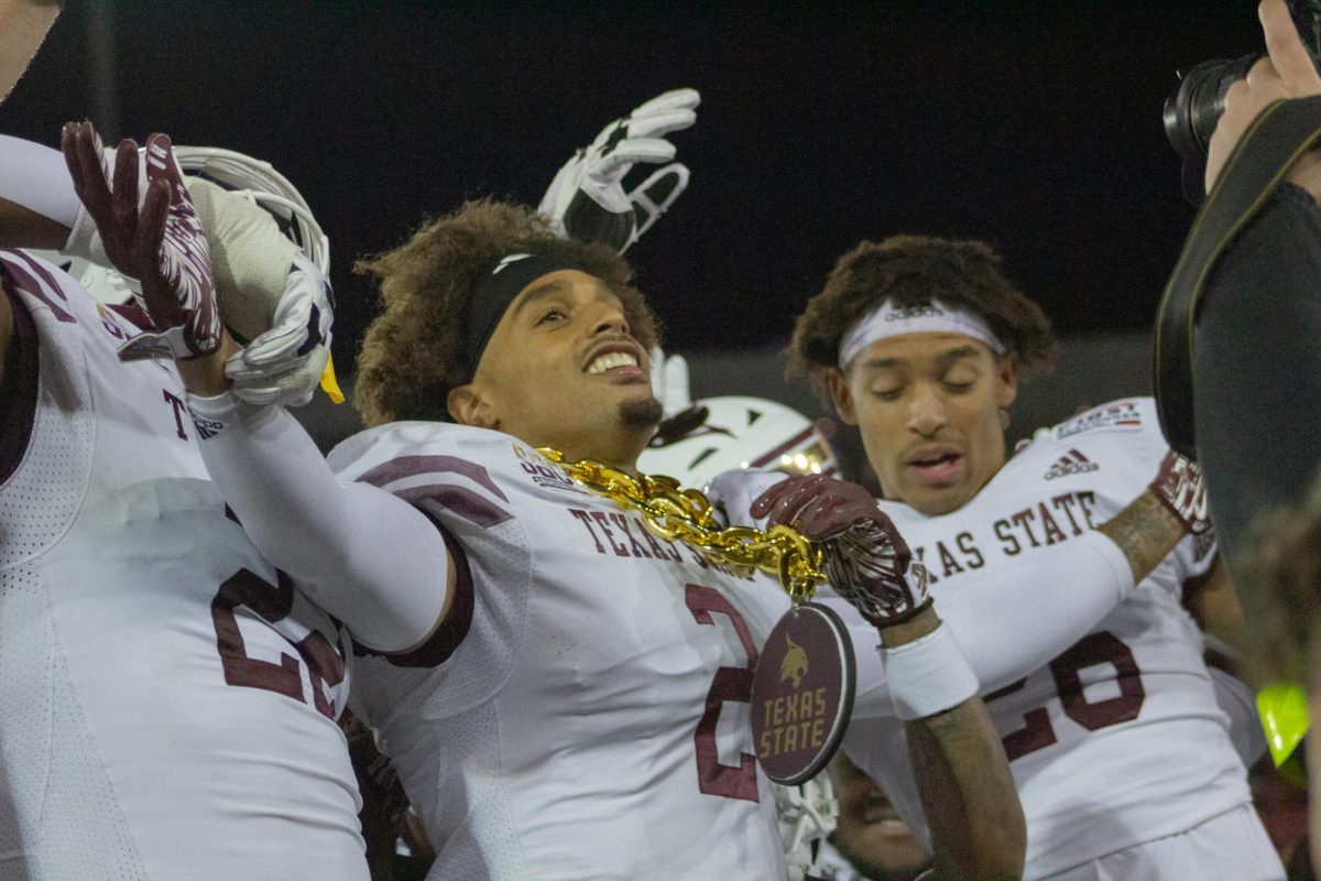 Texas State senior cornerback Kaleb Ford-Dement (2) is congratulated with the turnover chain during the SERVPRO First Responder Bowl game versus Rice, Tuesday, Dec. 26, 2023, in Gerald J. Ford Stadium.