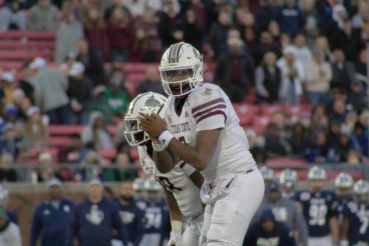 Texas State redshirt sophomore quarterback T.J. Finley (7) prepares to snap the ball versus Rice during the SERVPRO First Responder Bowl game versus Rice, Tuesday, Dec. 26, 2023, at Gerald J. Ford Stadium.
