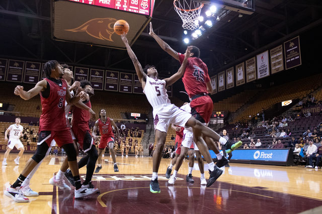 Texas State sophomore guard Jordan Mason (5) attempts to score during the game against Arkansas State, Saturday, Jan. 20, 2024, at Strahan Arena.
