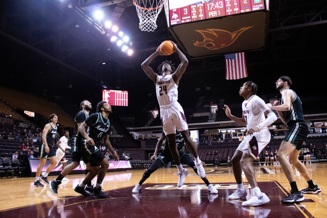 Texas State junior forward Brandon Love (24) jumps to dunk the ball during the game against Marshall, Saturday, Jan. 6, 2024, at Strahan Arena.