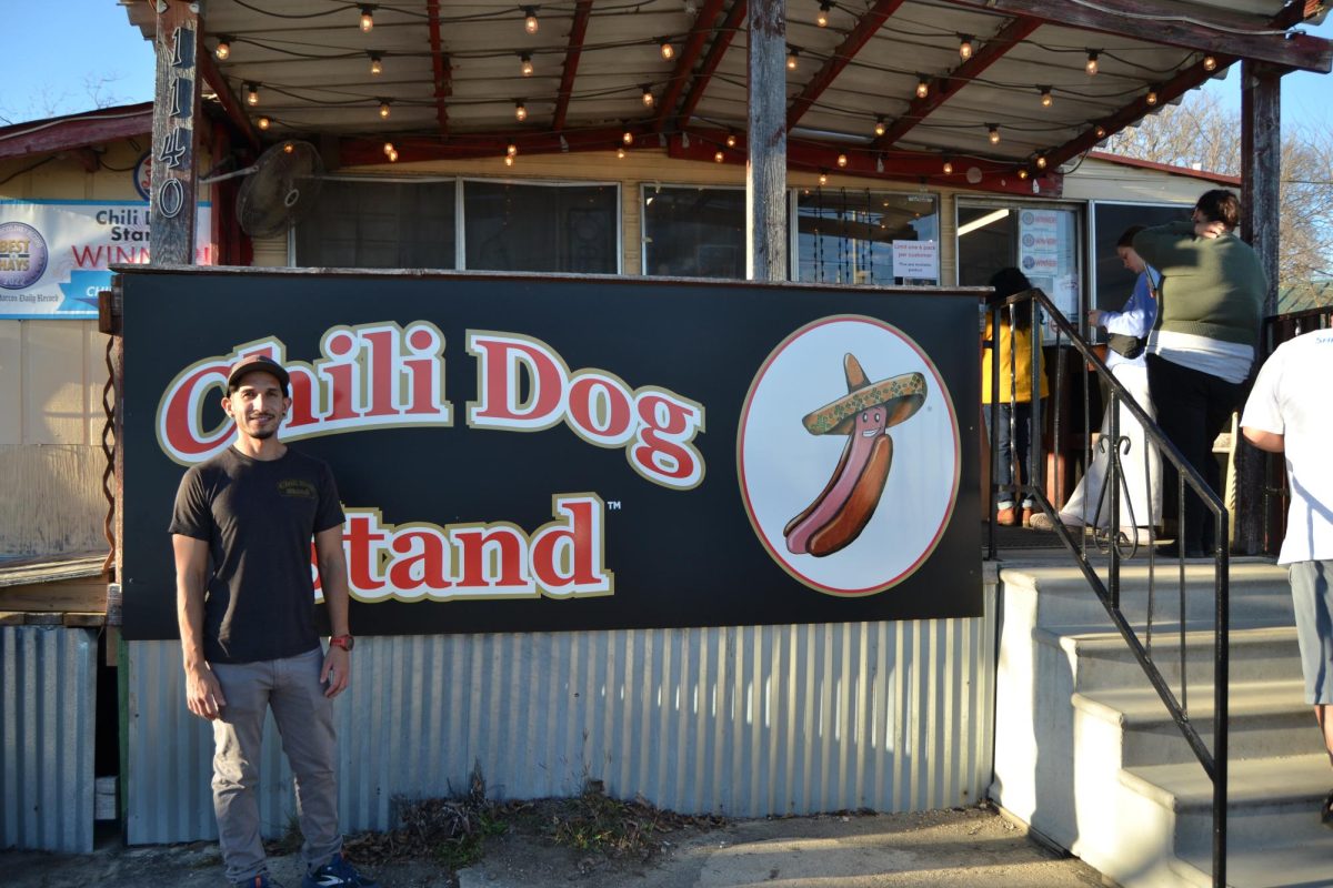 Owner Gabriel Garza standing in front of his stand on its last day on Dec. 30, 2023, at Chili Dog Stand.