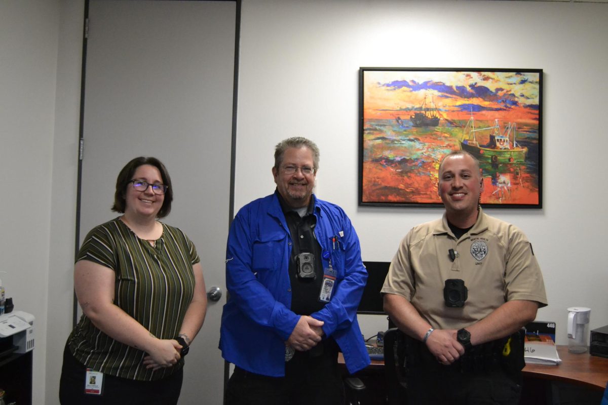 Mental health unit (left to right) Kelly Castillio, Grant Sheridan and Joseph Osborne posing for a photo in their office on Jan. 11, 2024, at the San Marcos police station.