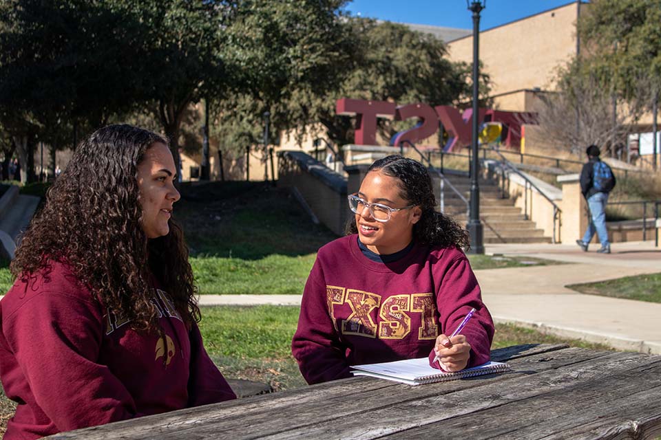 Psychology junior and peer mentor Aysia Banks offers assistance to fellow students Sunday, Jan. 17, 2024, outside Commons Dining Hall.