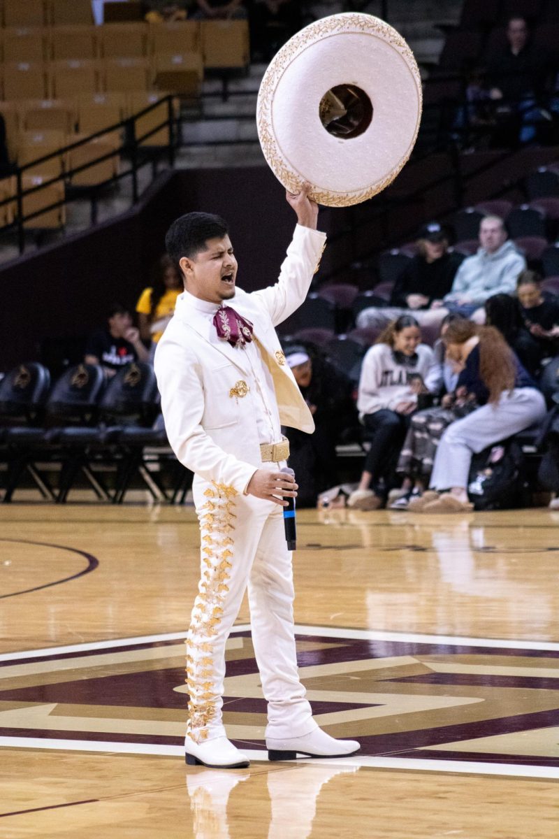 Business management sophomore Pablo Cardona performs Que Chulada de Mujer at the mens basketball halftime show, Saturday, Jan. 20, 2024, in Strahan Arena.