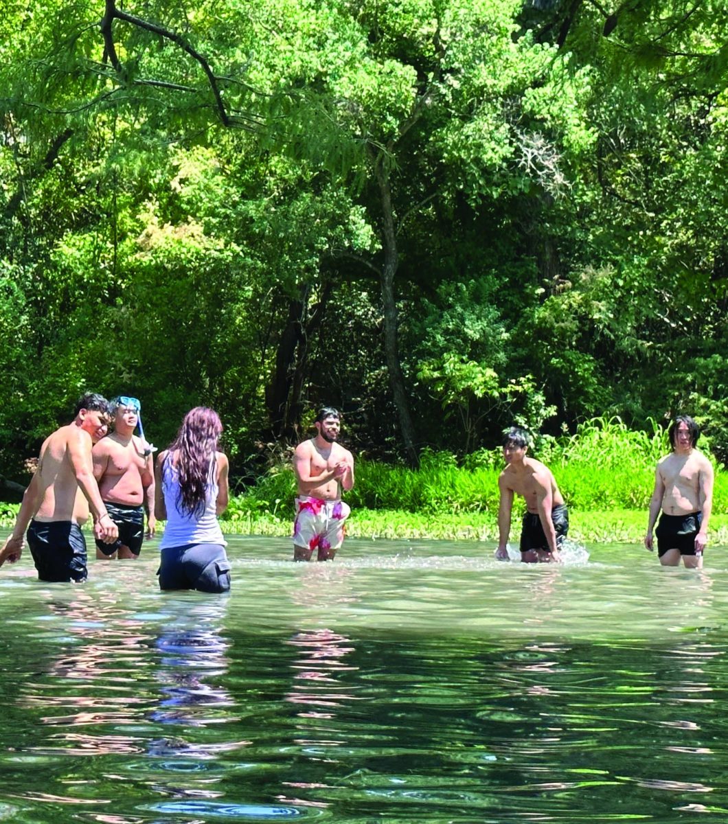 River-goers play a game of volleyball standing up due to the low river levels, Saturday, Aug. 26, 2023, at the San Marcos River in San Marcos.