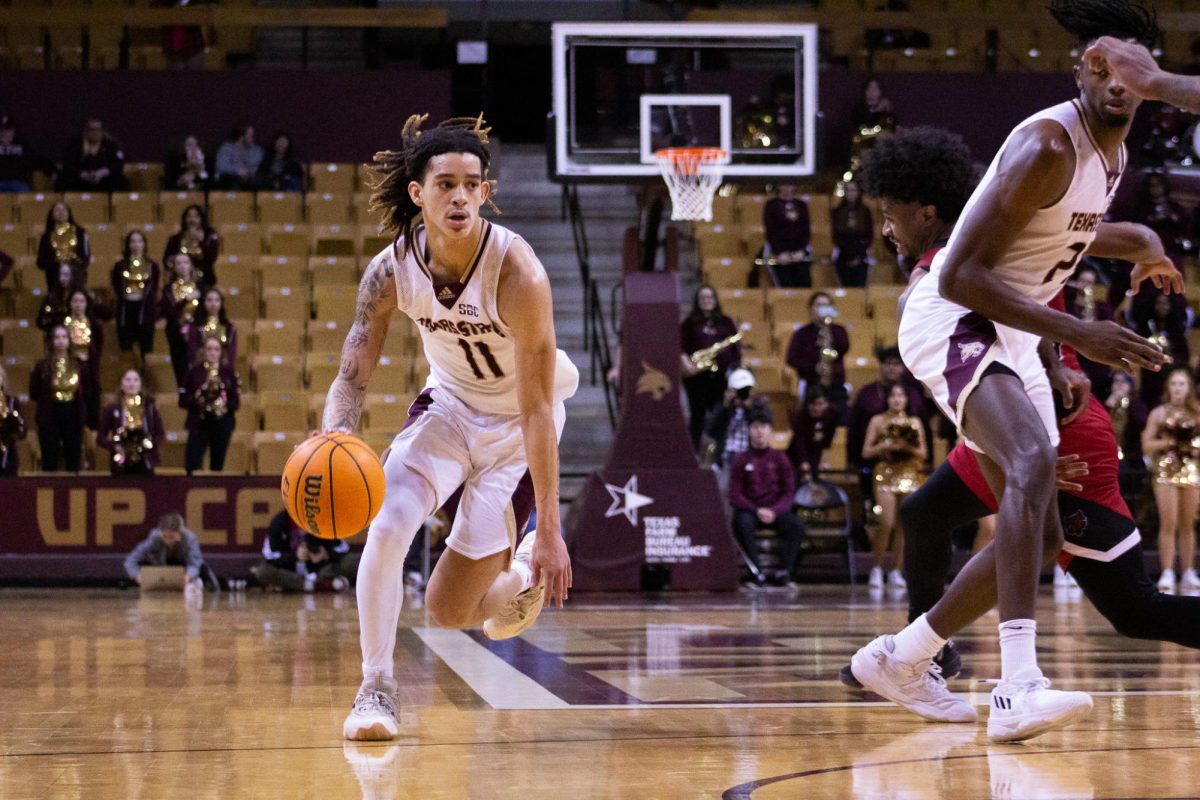 Texas State freshman guard Kaden Gumbs (11) dribbles the ball down the court, Saturday, Jan. 20, 2024, at Strahan Arena. 