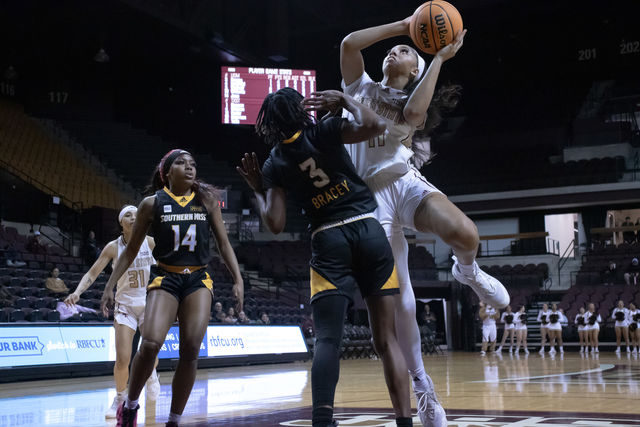 Texas State junior forward Jaylin Foster (11) attempts a layup, Wednesday, Feb. 28, 2024, at Strahan Arena. 