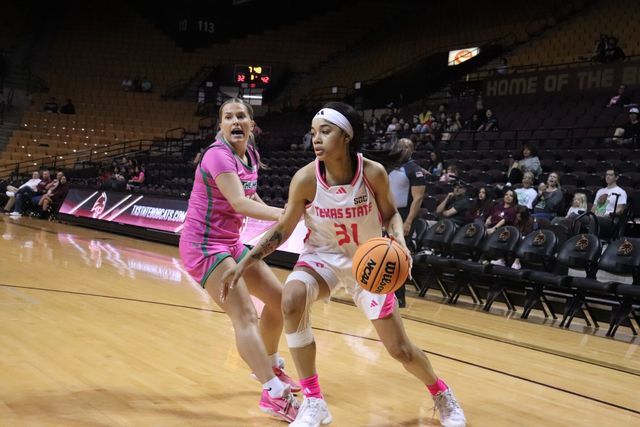Texas State junior forward Tiffany Tullis (31) dribbles toward the basket, Wednesday, Feb. 21, 2024, at Strahan Arena. 