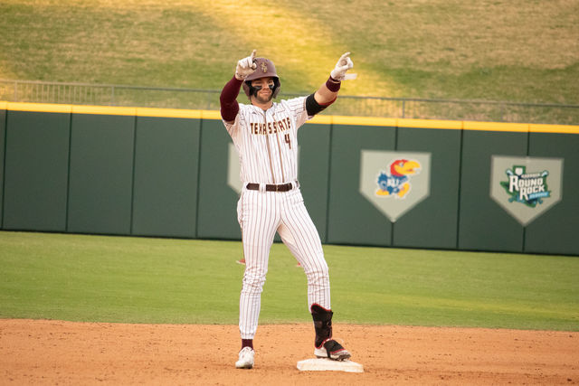 Texas State senior infielder Cameron Thompson (4) celebrates making it to second base after hitting a double, Sunday, Feb. 25, 2024, at Dell Diamond in Round Rock, Texas.