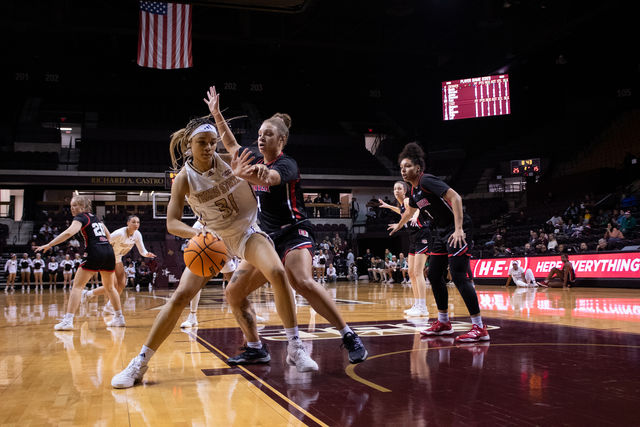 Texas State junior forward Tiffany Tullis (31) fights to keep possession of the ball during the game against Denver, Thursday, Dec. 14, 2023, at Strahan Arena.