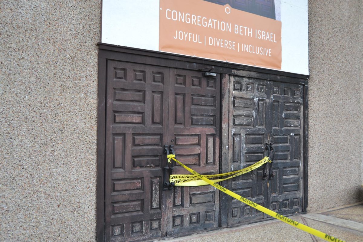 Caution tape surrounds the burnt doors of the CBI sanctuary, Wednesday, Feb. 14, 2024 in Austin. 