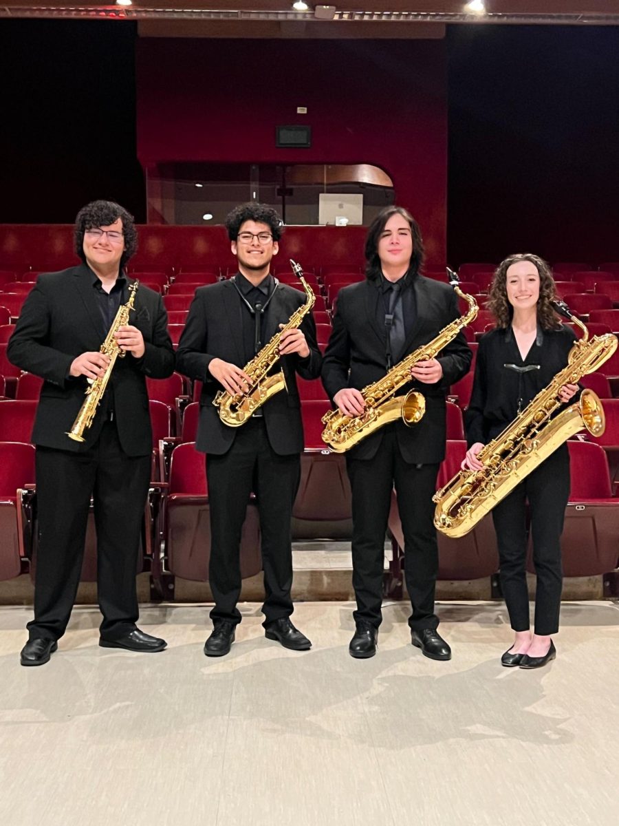 (From left to right) Music studies junior  Tomas Hinojosa and sophomores Jaime Fernandez, Miles Avelar and Emma Hallett posing with their instruments, Jan. 25, 2024, at the School of Music Building. 