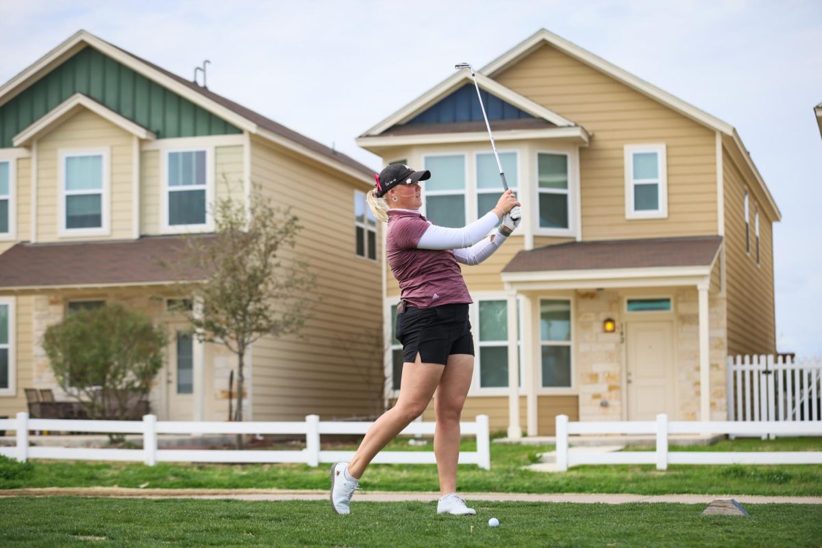 Texas State junior golfer Matilda Svahn watches the ball after hitting it, Friday, Feb. 16, 2024, at the Plum Creek Golf Course in Kyle, Texas.