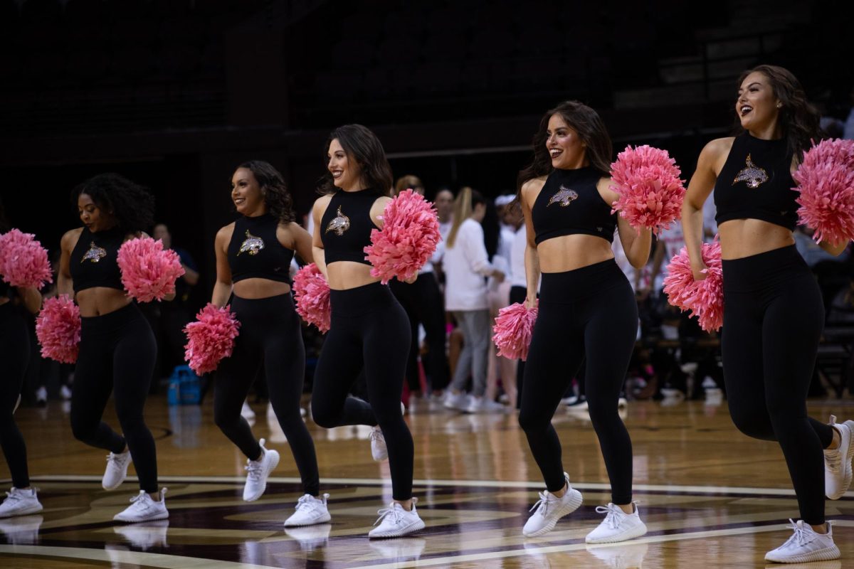 Texas State strutters take the court to hype up the crowd during break at the womens basketball game against Marshall, Wednesday, Feb. 21, 2024, at Strahan Arena.