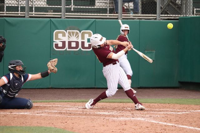 Texas State graduate student infielder Sara Vanderford (26) hits the ball, Thursday, Feb. 8, 2024, at the Bobcat Softball Stadium. 