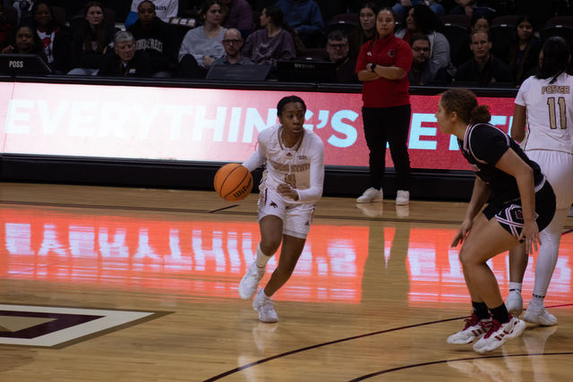 Texas State senior guard Sierra Dickson (4) dribbles the ball down the court during the game against Arkansas State, Saturday, Jan. 20, 2024, at Strahan Arena.