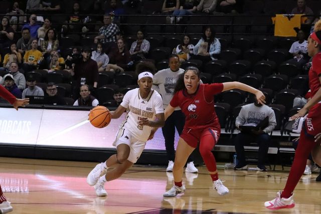Texas State junior guard Crystal Smith (3) dribbles past her defender, Saturday, Feb. 3, 2024, at Strahan Arena. 