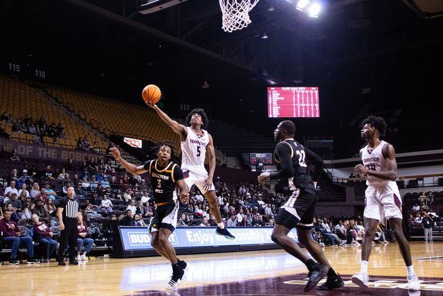 Texas State sophomore guard Jordan Mason (5) attempts a layup during the game against Southern Miss, Saturday, Feb 3, 2024, at Strahan Arena.