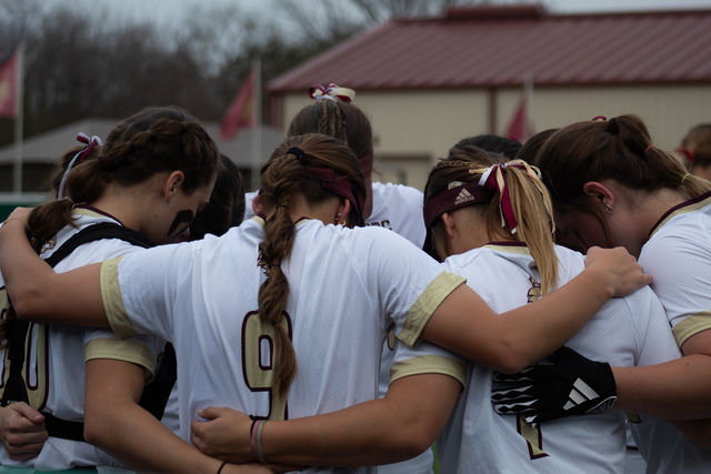 The Texas State softball team huddles up before the game against Kennesaw State, Friday, Feb. 9, 2024, at Bobcat Softball Stadium.