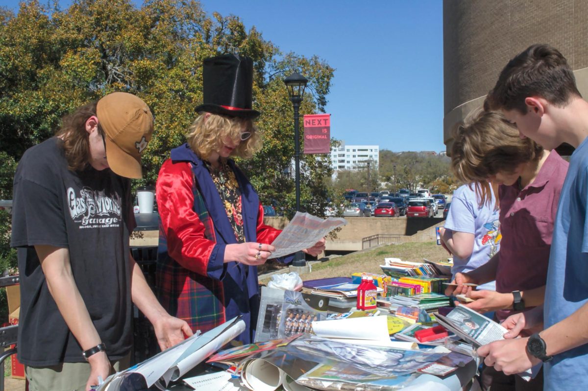 Students check out different posters and papers on tables during the German contest, Saturday, Feb. 24, 2024, outside of Centennial Hall.