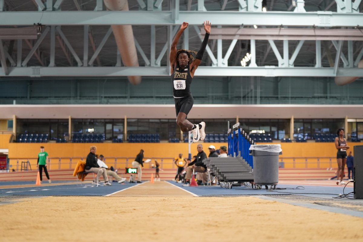 Texas State sophomore long jumper Chris Preddie leaps in the air during the mens long jump event at the Sun Belt Conference Indoor Championships, Monday, Feb. 19, 2024, at the Birmingham CrossPlex in Birmingham, Alabama.