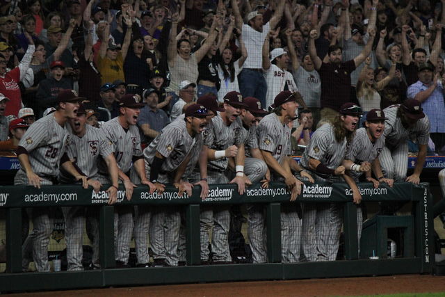 The Texas State baseball team cheers on teammates during the last pitch of the game against Texas, Saturday, March. 2, 2024, Minute Maid Park in Houston.
