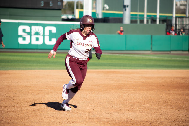 Texas State graduate student infield Sara Vanderford (26) rushes to third base during the game against Texas Tech, Sunday, Feb. 18, 2024, at Bobcat Softball Stadium.