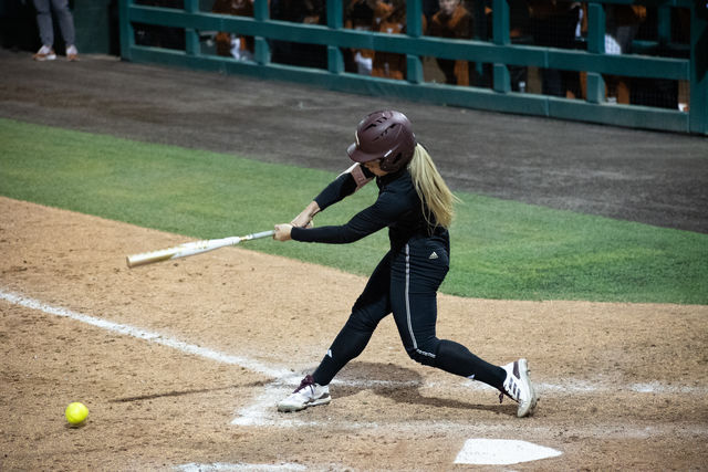 Texas State senior outfielder Piper Randolph (11) hits the ball during the game against Texas, Wednesday, Feb. 28, 2024, at Bobcat Softball Stadium.