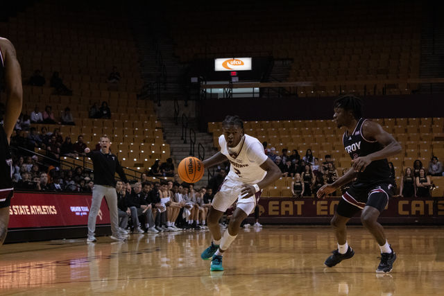 Texas State junior guard Dontae Horne (2) dribbles the ball down the court during the game against Troy, Friday, March. 1, 2024, at Strahan Arena.