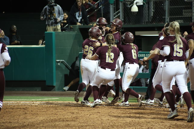 The Texas State softball team celebrates its victory over Texas A&M, Wednesday, March. 20, 2024, at Bobcat Softball Stadium. 