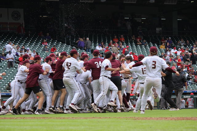 The Texas State baseball team storms the field to celebrate its victory over the University of Houston in the Astros Foundation Classic, Friday, March. 1, 2024, Minute Maid Park in Houston. 