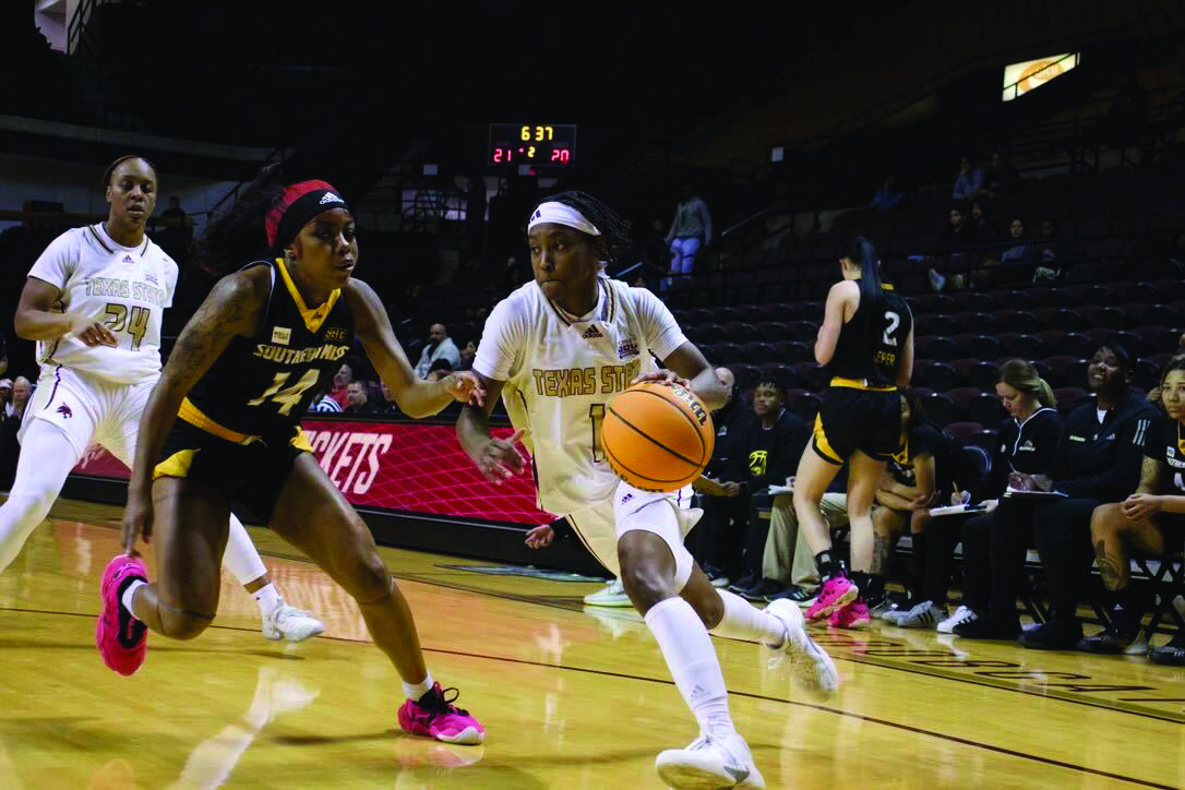 Texas State graduate student guard Ja’Niah Henson (1) dribbles past her defender in the game against Southern Miss, Wednesday, Feb. 28, 2024, at Strahan Arena.