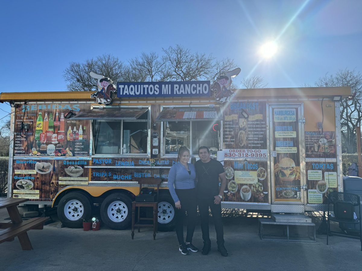 Taquitos Mi Rancho owners Maria Del Rosario Rubio (left) and Augusto Galindo (right) stand in front of their business on Monday, Feb. 12, 2024, in San Marcos.