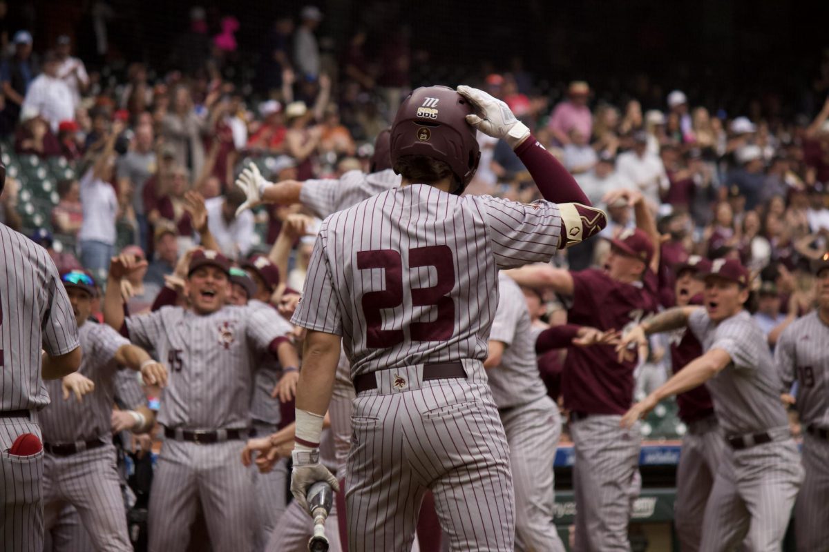 Texas State baseball celebrates homerun made by sophomore Chase Mora (2) with senior infielder Alec Patino (23), freshman infielder Ryne Farber (31), and junior infielder Aaron Lugo (1), March 2, 2024, Minute Maid Park.